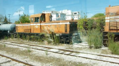 
2-8-2 '7115', Breda 2596/1951, hiding behind the diesel at Pyrgos yard, Greece, September 2009